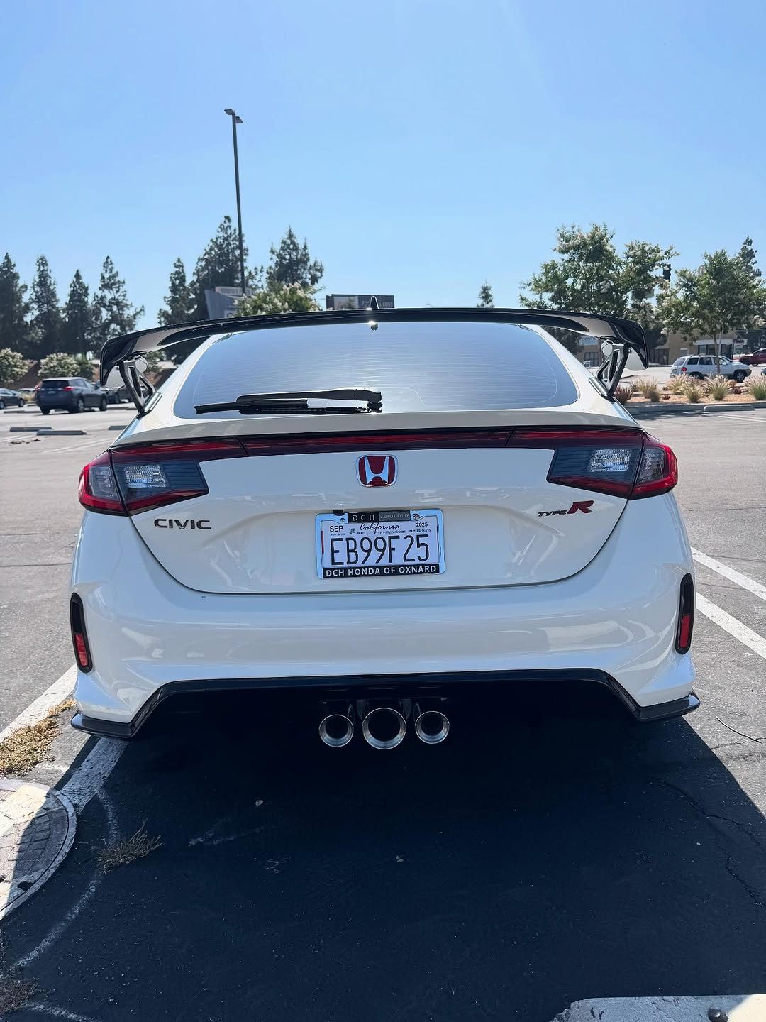 White sedan, rear, after a maintenance detail in the Valley