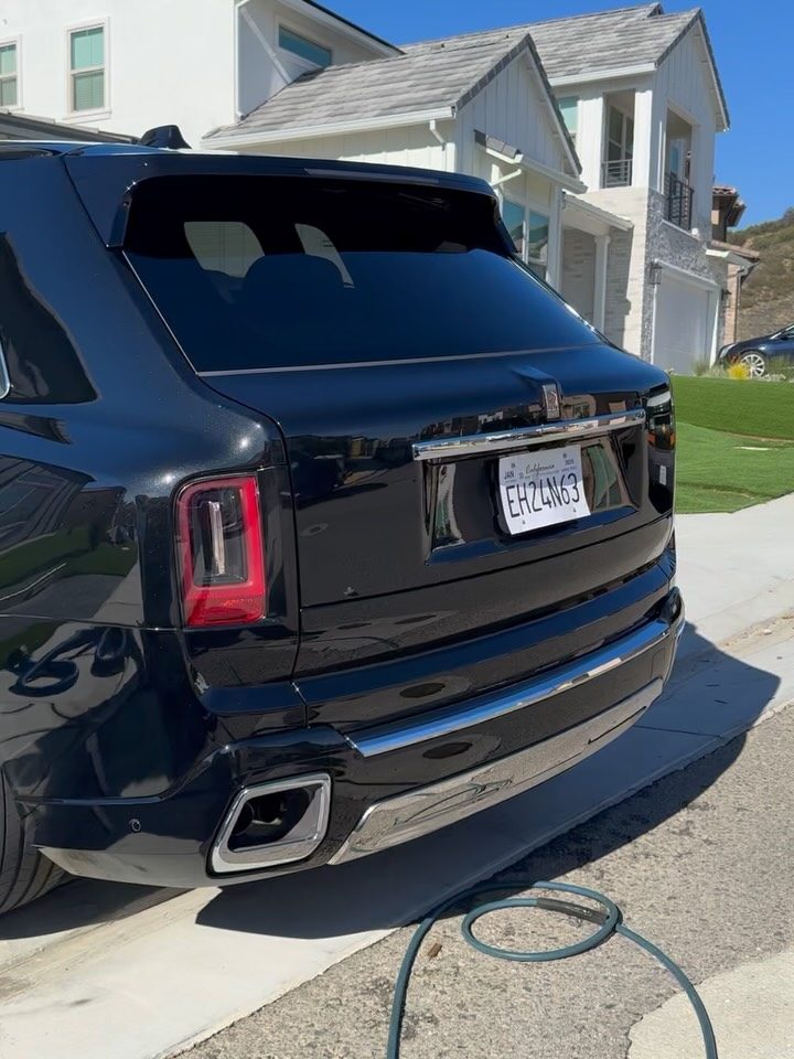 Black SUV, rear, after a full exterior detail