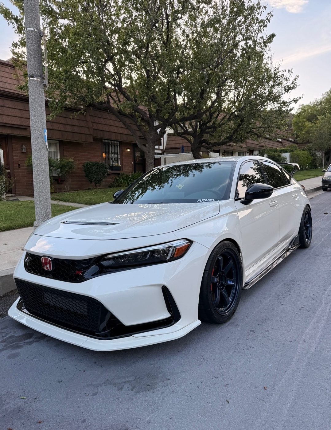 White muscle car, rear quarter, after a full exterior detail